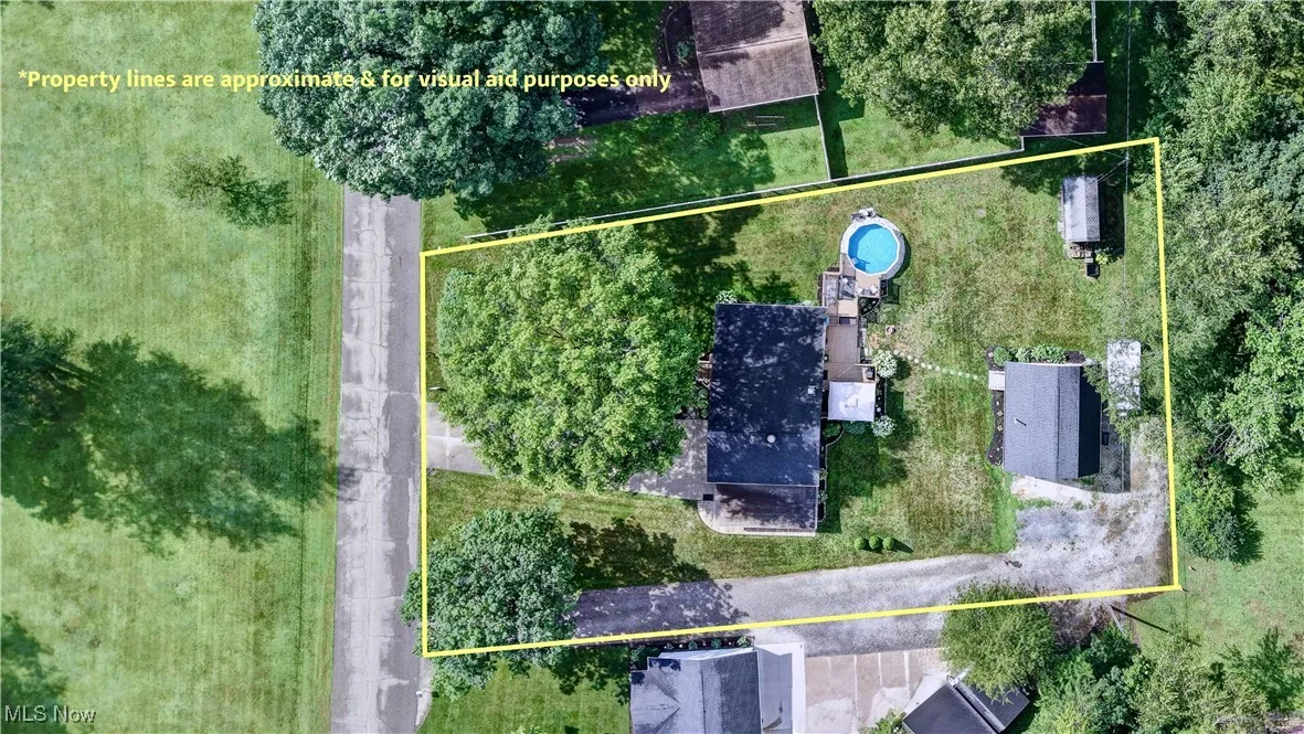 Aerial view of property and surrounding area with property boundaries highlighted
