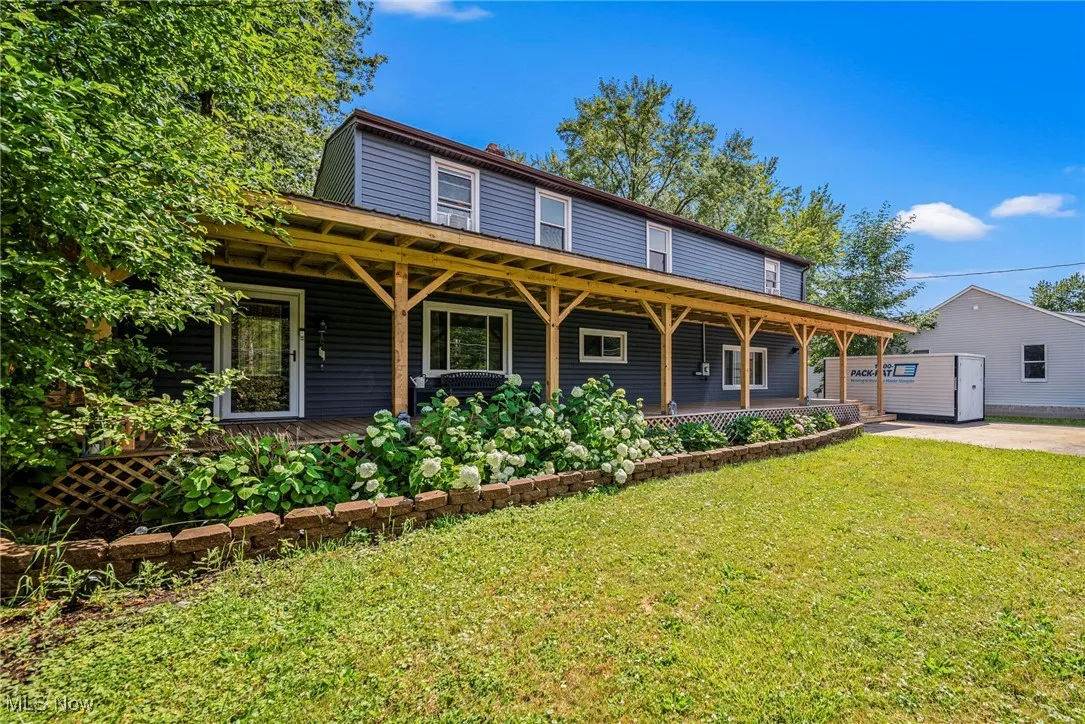 View of front of home featuring a porch and a front lawn