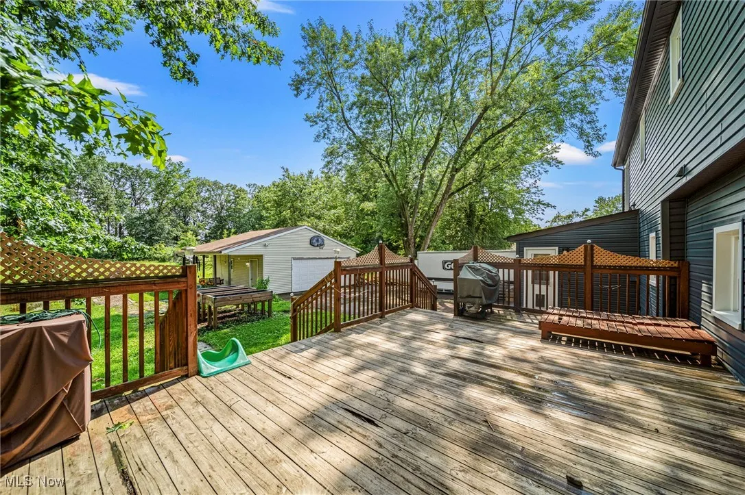 Deck with grilling area and an outbuilding