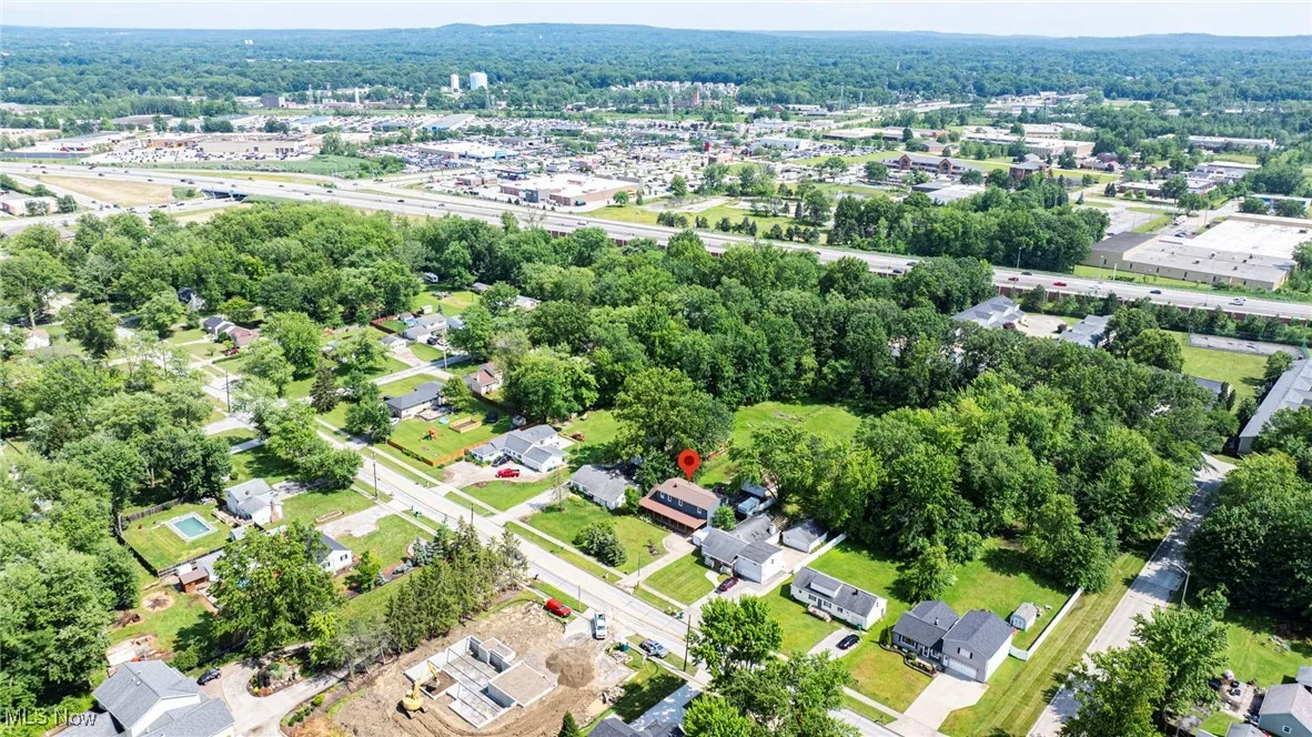 Aerial overview of property's location featuring nearby suburban area