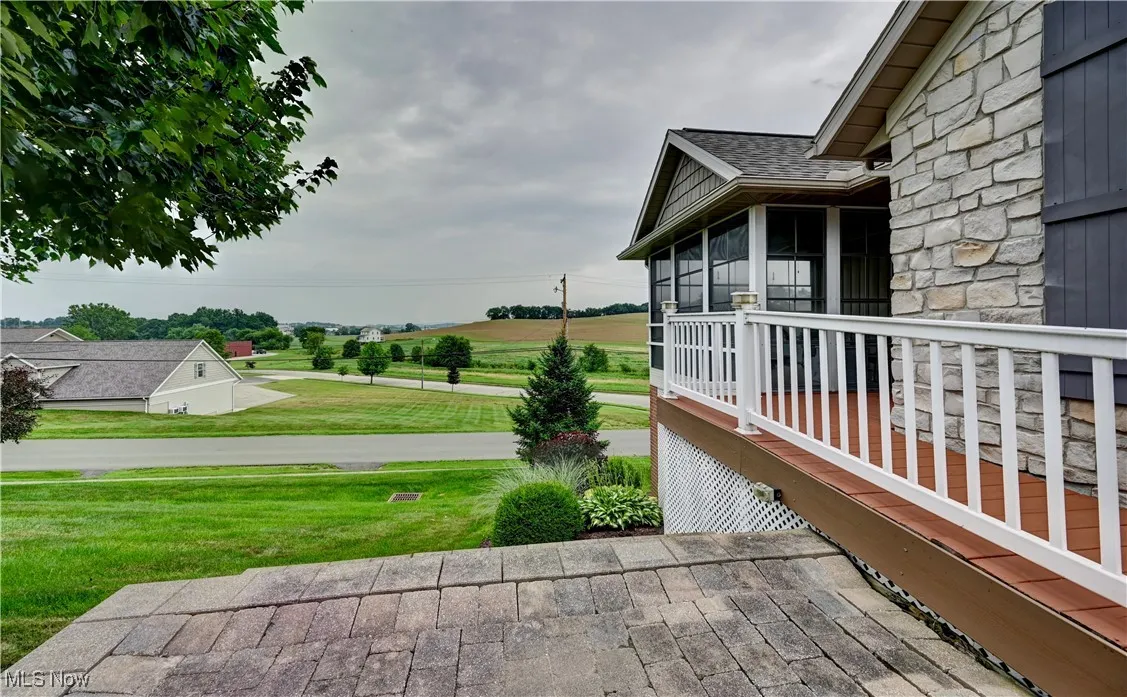 View of patio / terrace featuring a sunroom