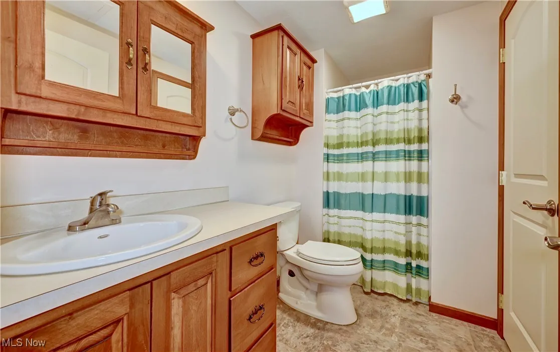 Bathroom with vanity and a shower with curtain