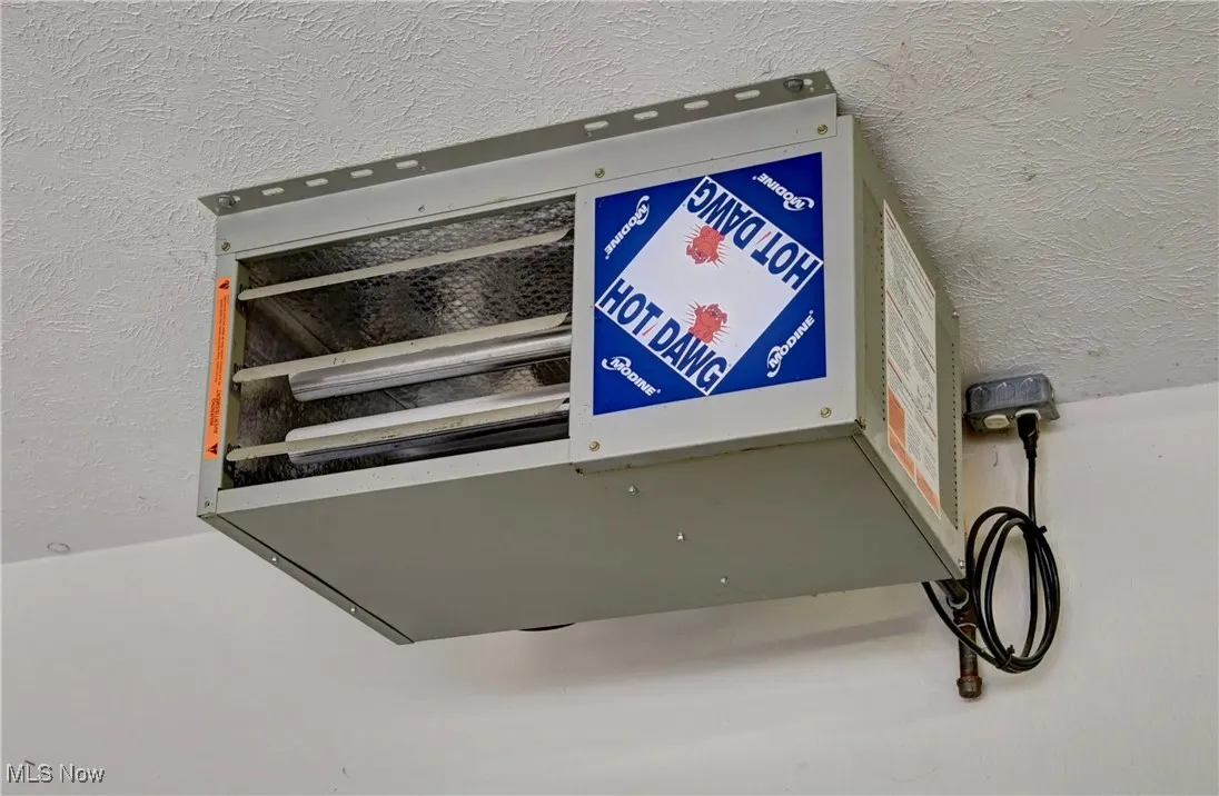 Detailed view of a heating unit and stucco siding