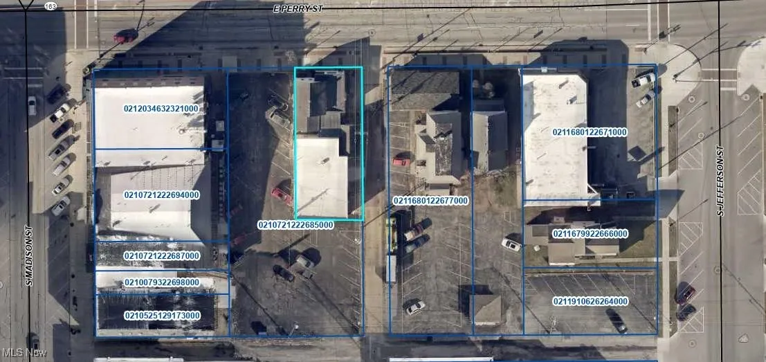 Aerial map of property and surrounding area with property parcel outlined