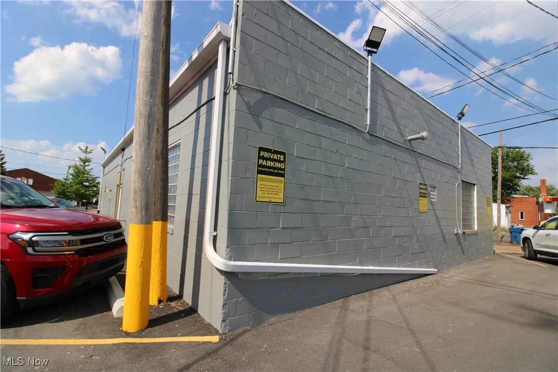 View of side of property with concrete block siding