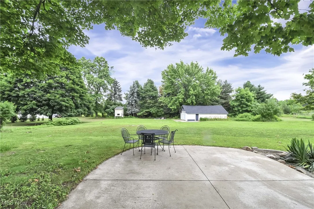 View of patio / terrace featuring a storage unit