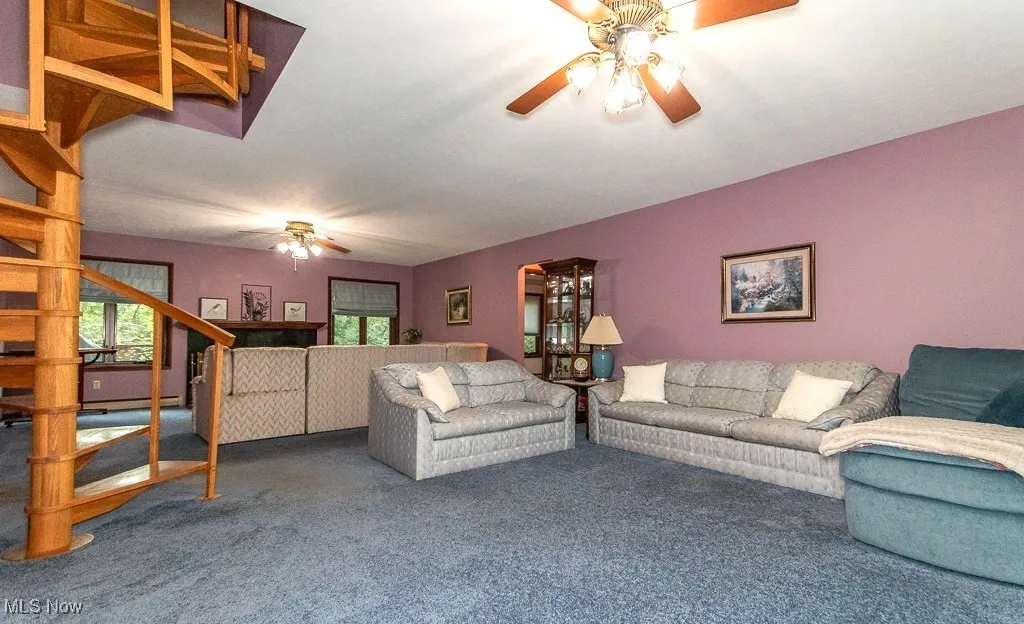 Living room with peek at staircase and fam rm