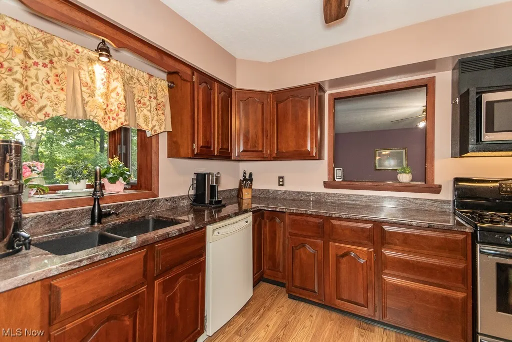 Kitchen: Marble counters, granite sink