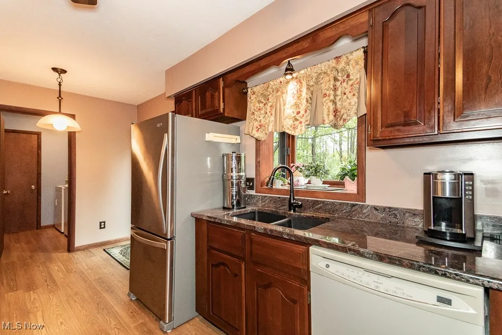 Kitchen view of laundry room and 1/2 ba