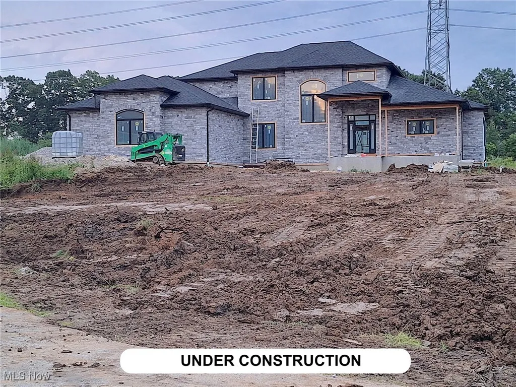View of front of home featuring stone siding
