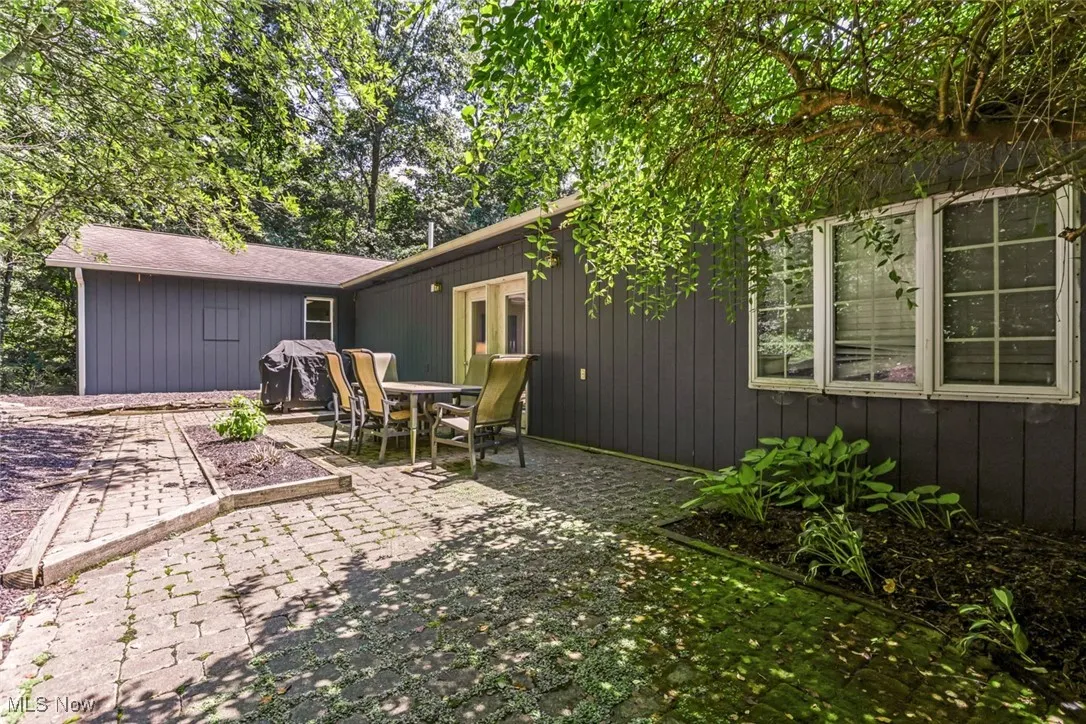 View of patio / terrace featuring outdoor dining space and a grill