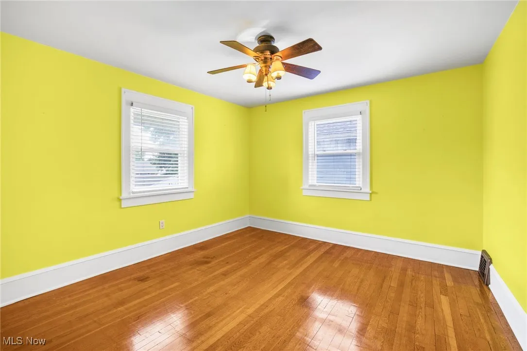 Bedroom with hardwood floors, and ceiling fan