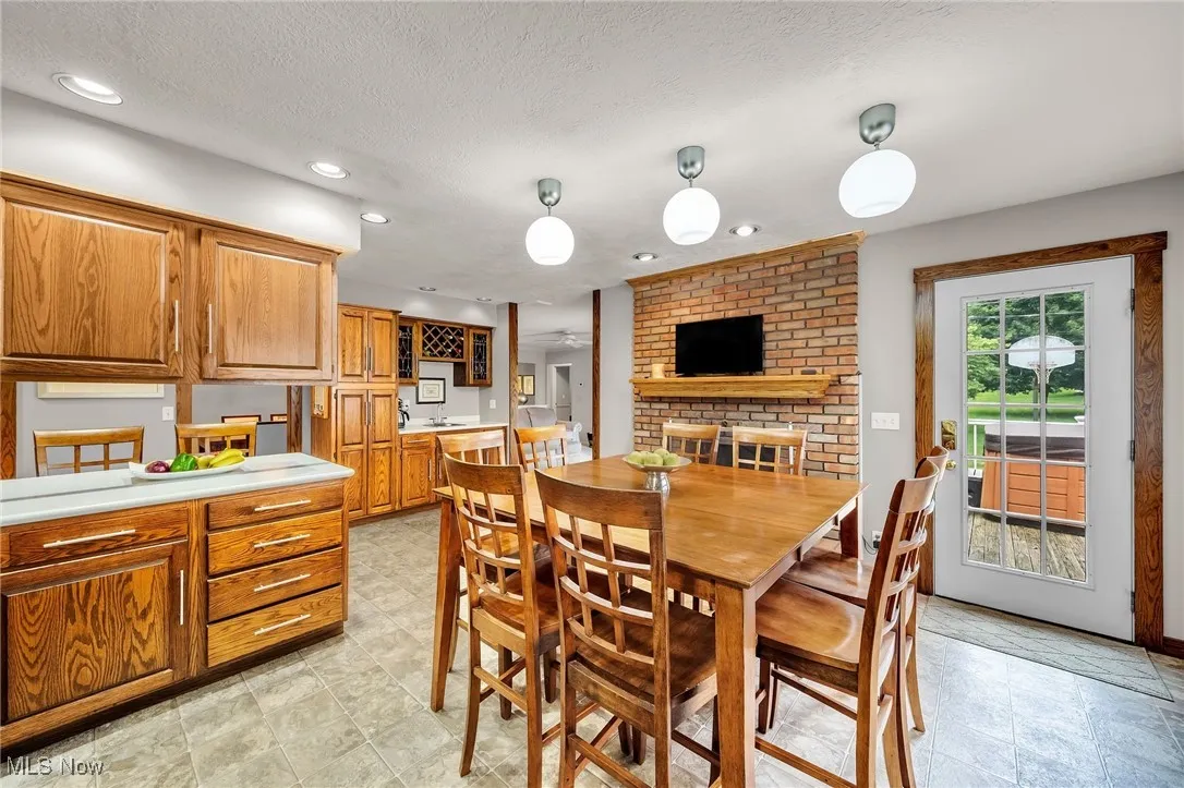 Dining space featuring recessed lighting and a textured ceiling