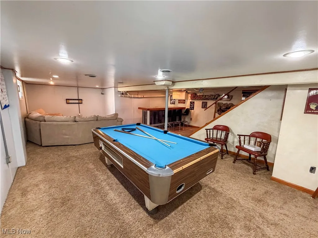 Recreation room featuring pool table and light colored carpet