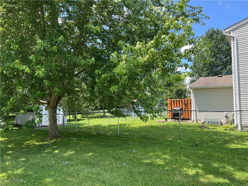 View of fenced backyard