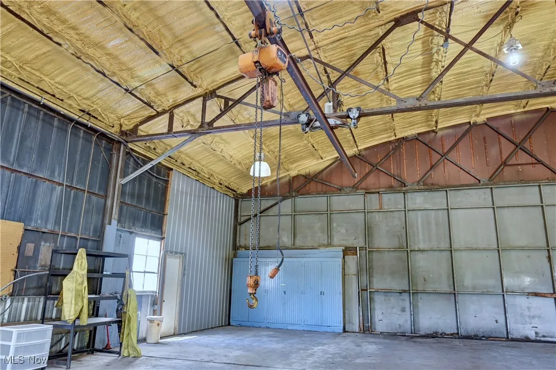 Garage featuring metal wall