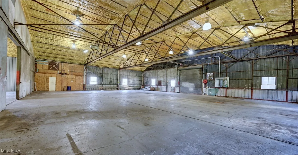 Garage featuring metal wall