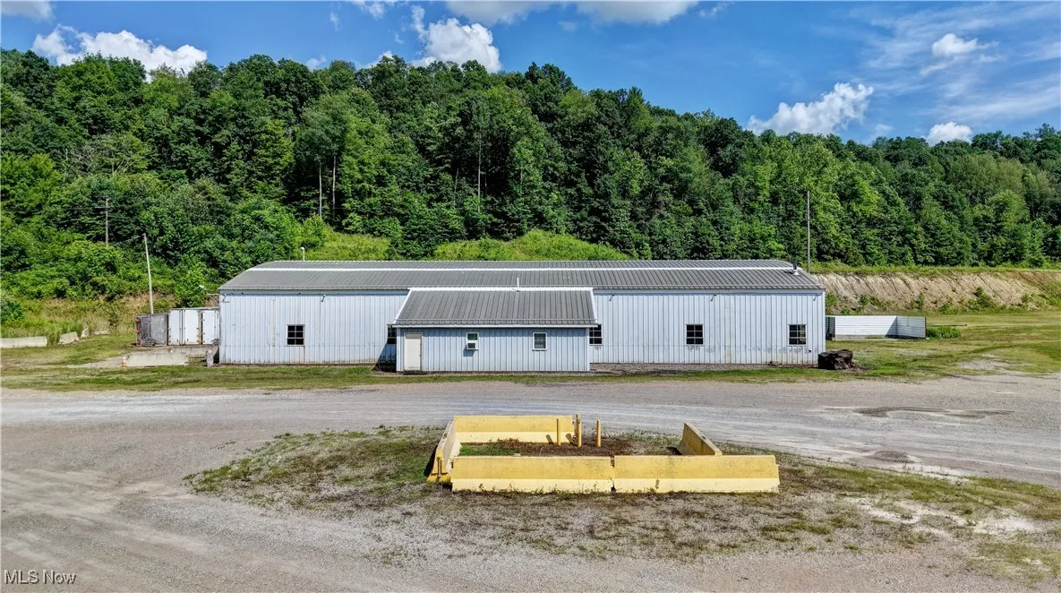 View of pole building with a view of trees