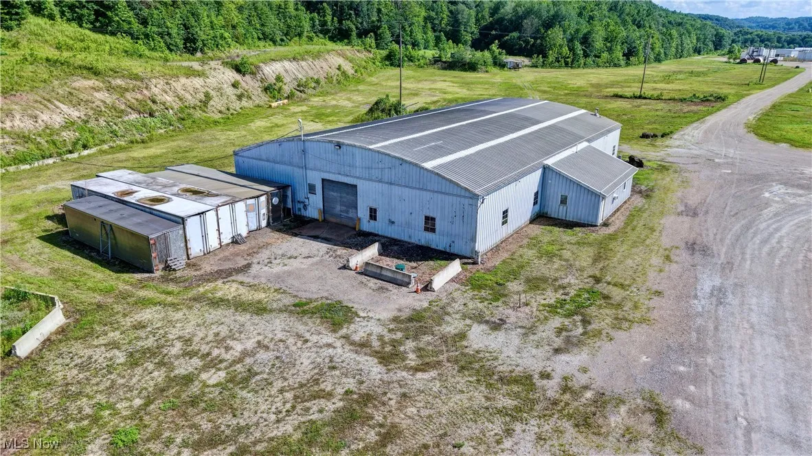 View of subject property with a forest