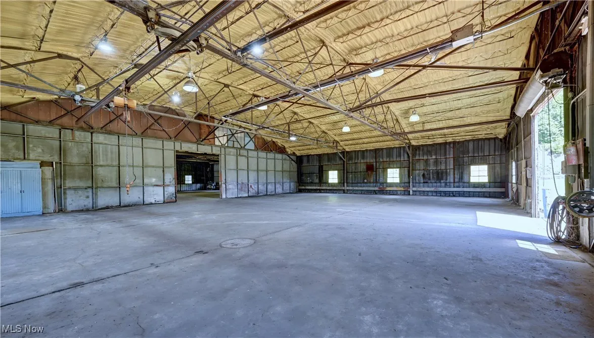 Garage featuring metal wall