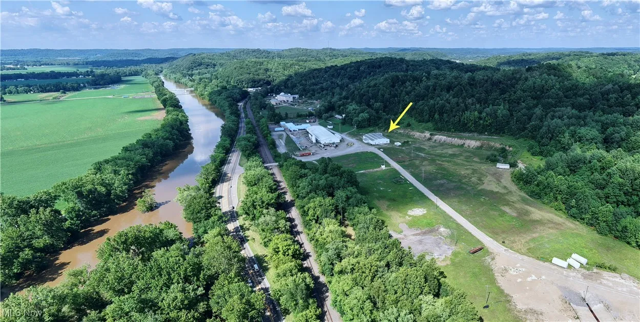 Aerial view of property and surrounding area featuring rural landscape