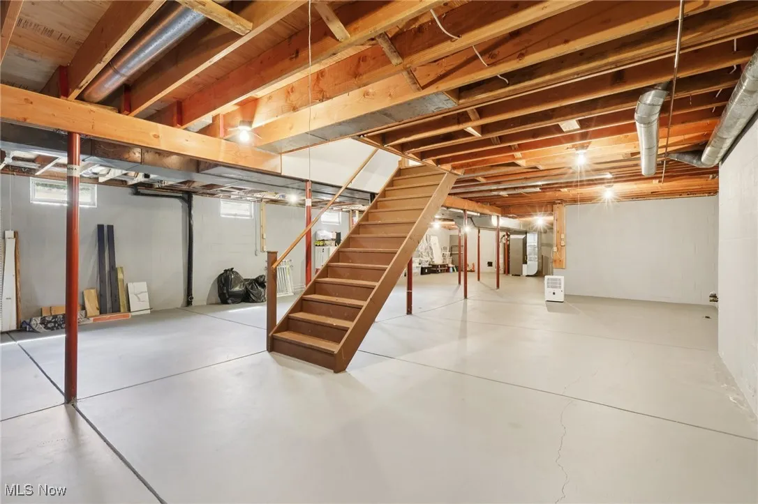 Basement featuring stairs