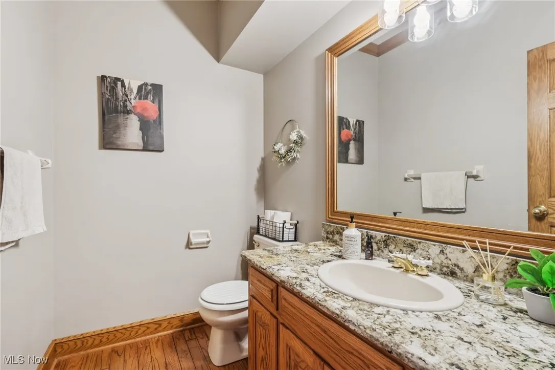 Bathroom featuring vanity and wood finished floors
