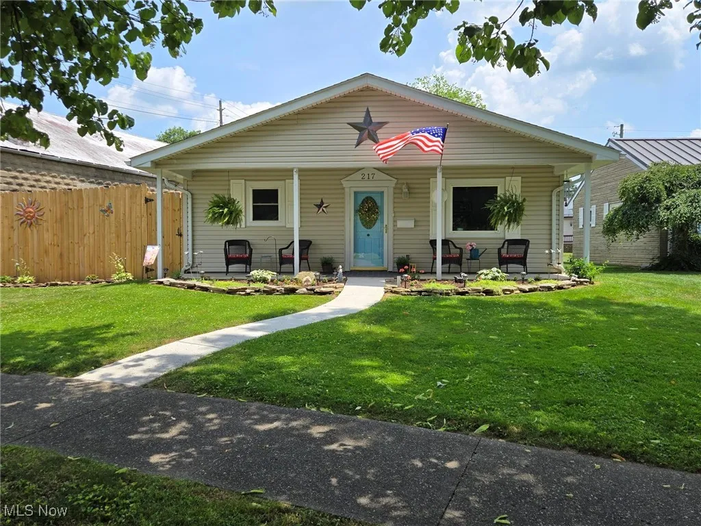Bungalow featuring covered porch