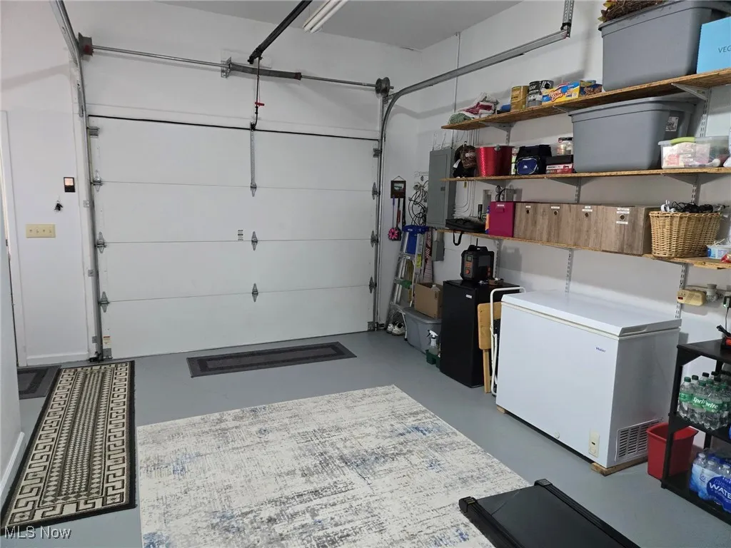 Garage with white refrigerator