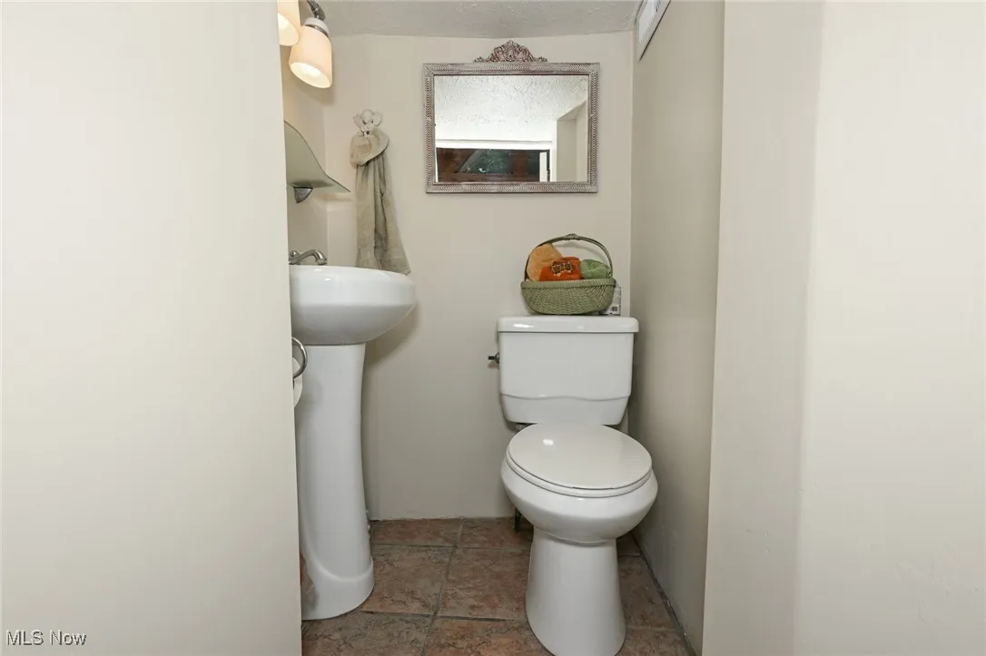 Half bath featuring toilet