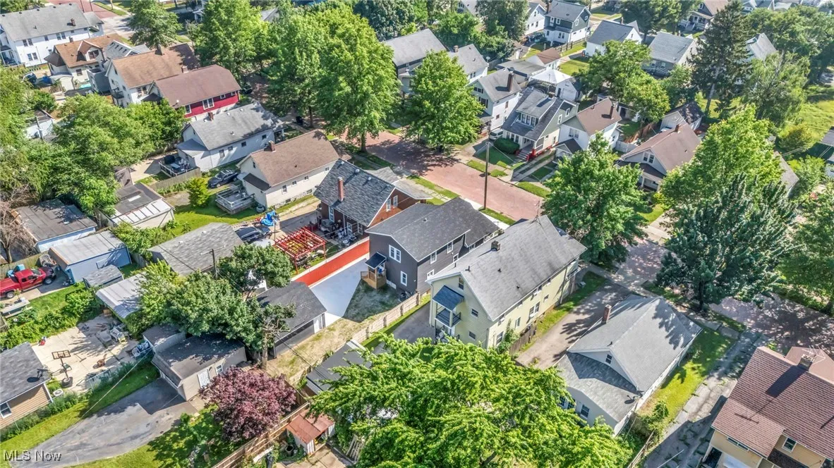 Aerial view of property's location with nearby suburban area