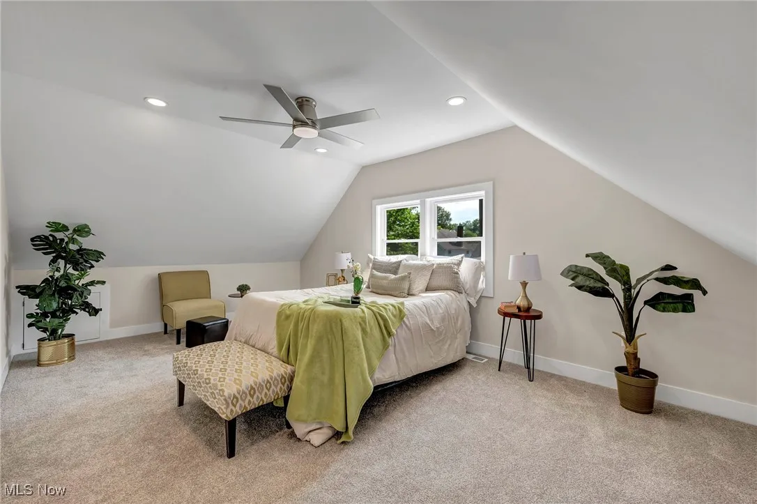 Bedroom with light carpet, vaulted ceiling, recessed lighting, and ceiling fan