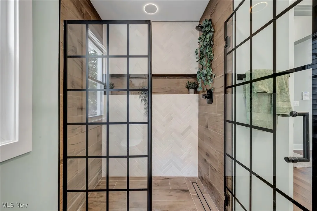 Full bath with a tile shower