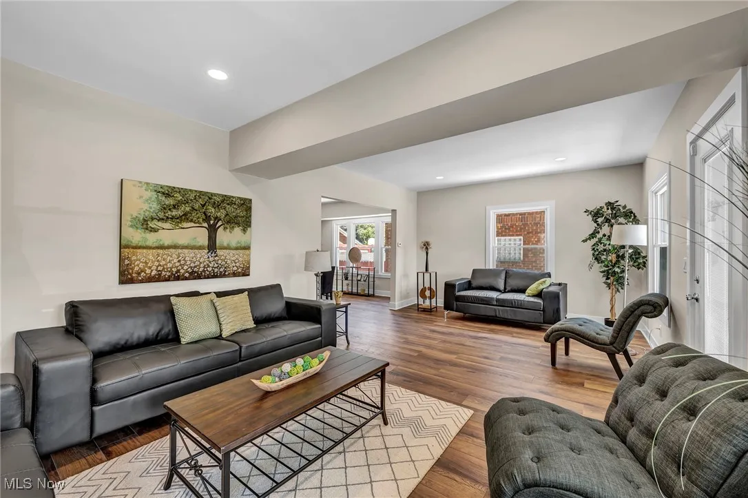Living room with wood finished floors and recessed lighting
