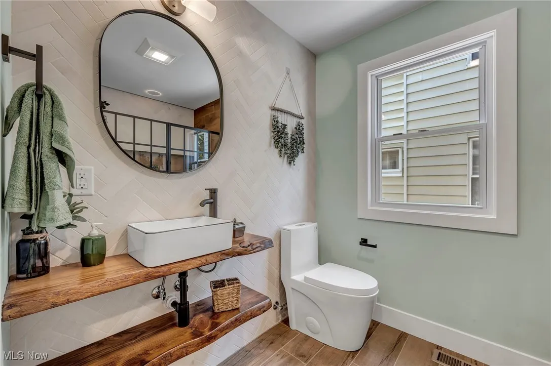 Bathroom with a sink and wood finished floors