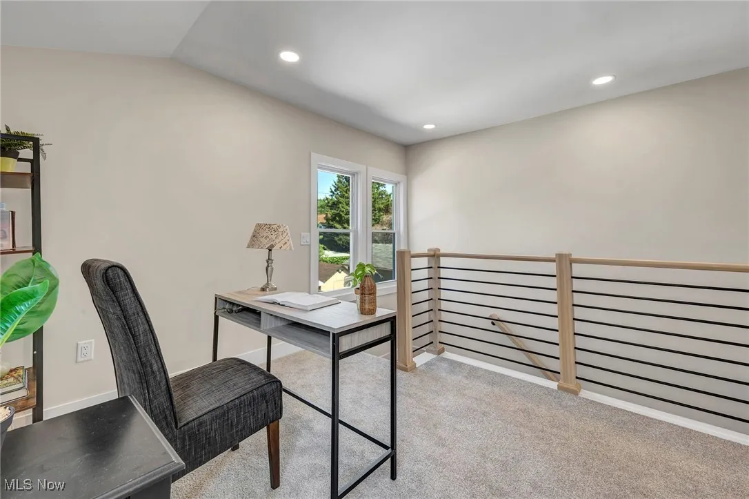 Carpeted office with recessed lighting