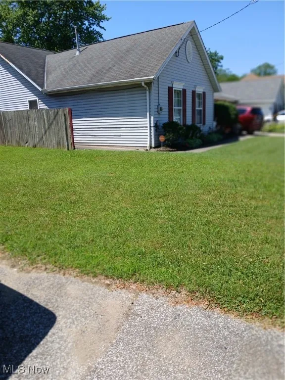 View of front of house with a shingled roof
