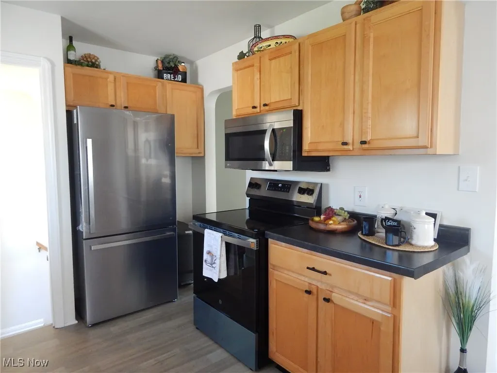 Kitchen featuring appliances with all stainless steel finishes, Luxury vinyl floors, and all new countertops. Refrigerator & Stove are brand new 25..