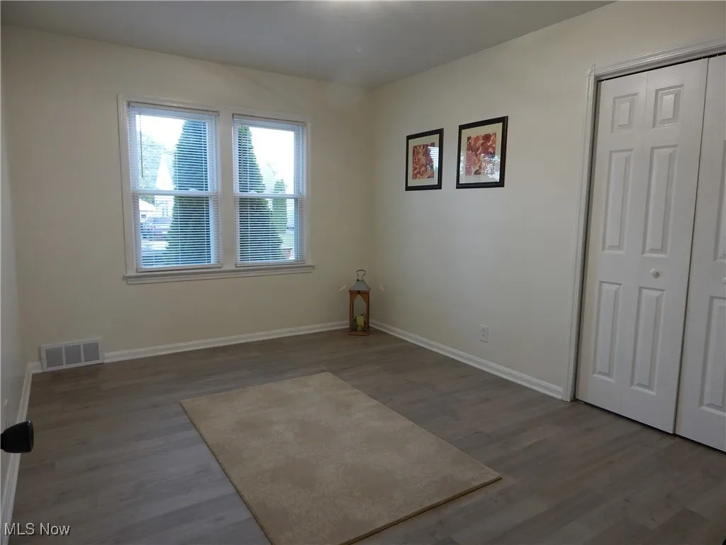 Master bedroom has LTV Flooring is freshly painted, updated windows, light fixture & blinds, features a double sized Walk-In Closet!