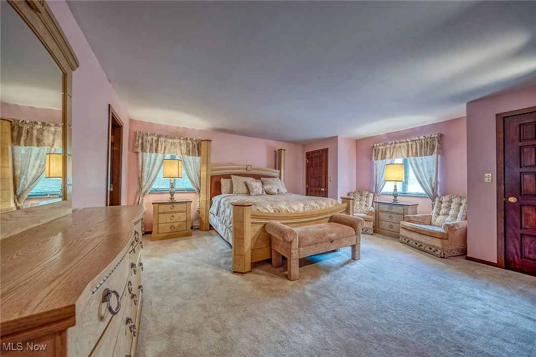 Bedroom with light colored carpet