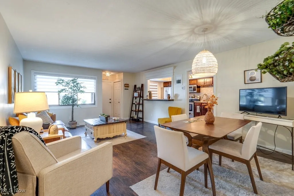 Living area with wood finished floors and baseboards
