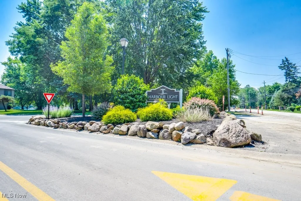 View of asphalt street with street lights