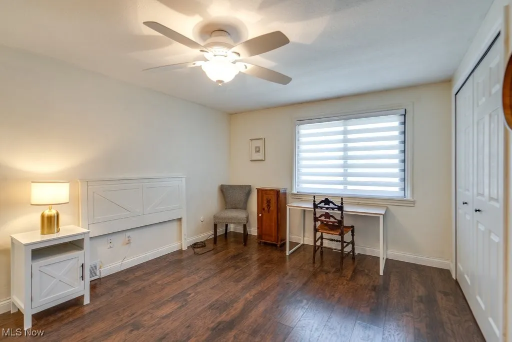 Office area featuring wood finished floors and a ceiling fan