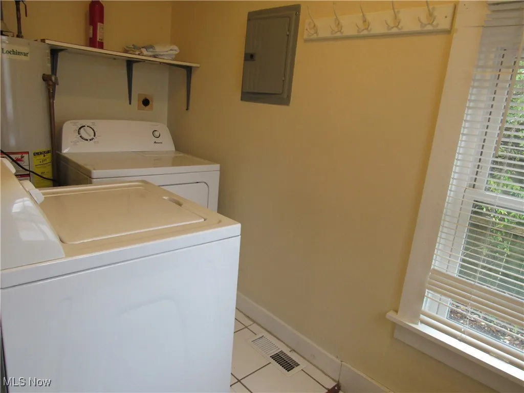 Other side of the laundry room so that you can see the ceramic tiled flooring & window for natural light!