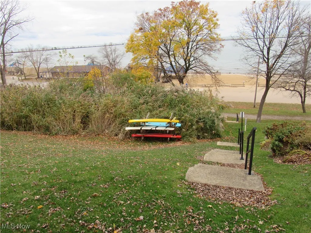 Rear yard has a staircase with handrail to access the Fairport Harbor Lakefront Park!