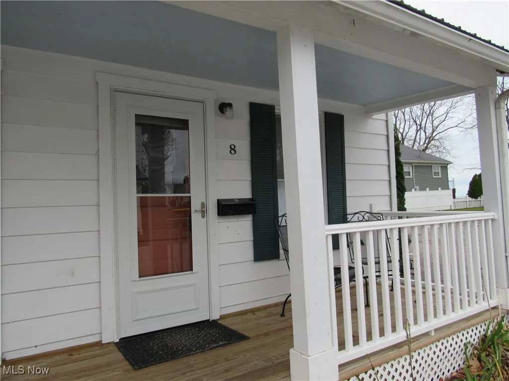 Front entry with newer porch & screen door to enjoy the Lake Erie views & breezes!