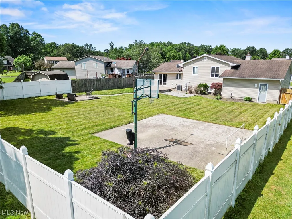 Fenced backyard with a patio and a residential view