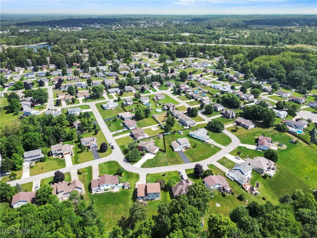 Aerial overview of property's location featuring nearby suburban area