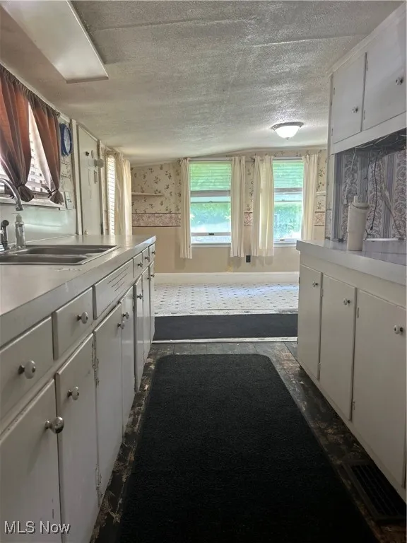Kitchen looking into bonus room, dining are to the right