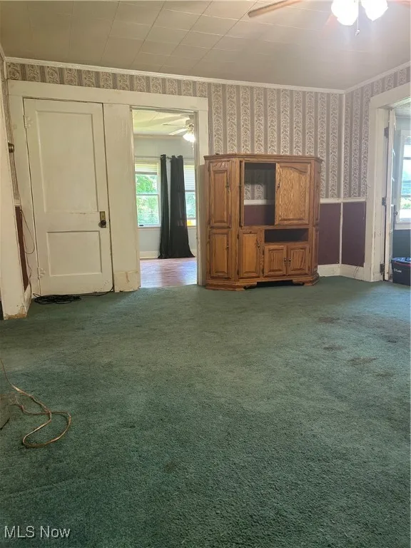 living room, front porch on right, looking into bedroom